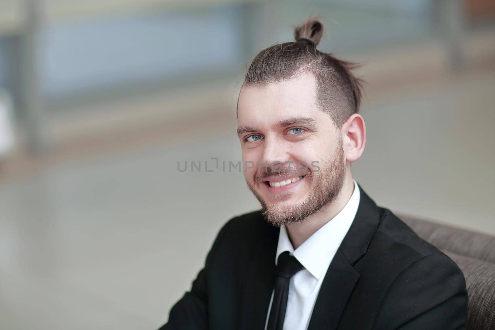 closeup. portrait of successful businessman on workplace in the office .photo with copy space