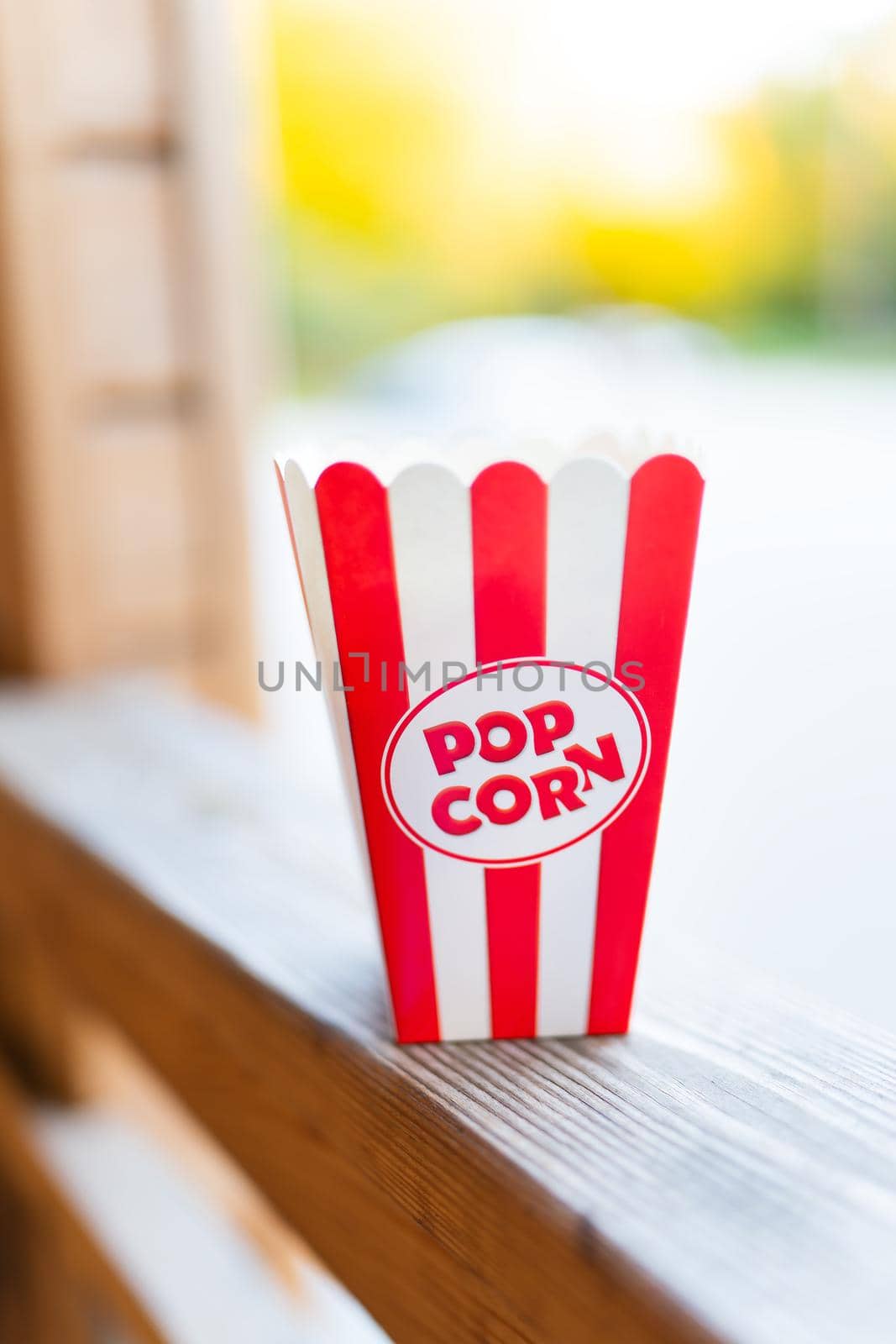 Classic red striped outdoor popcorn box. Going to the cinema