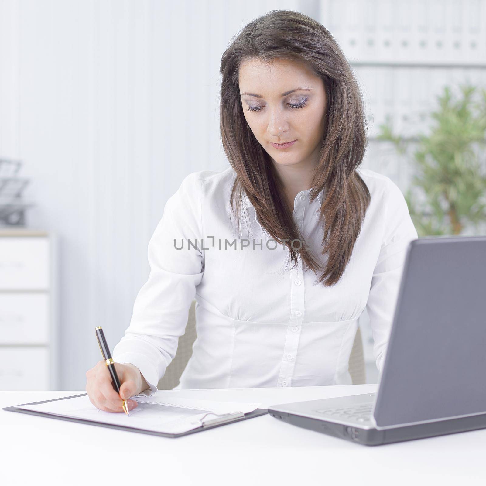 business woman analyzing the financial schedule.