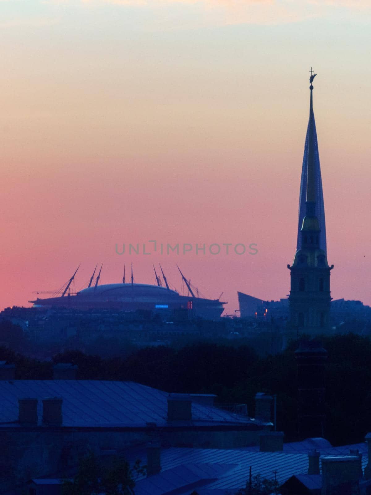 ST. PETERSBURG. RUSSIA - August 28, 2019. Krestovsky stadium, the Lakhta Center skyscraper and the Peter and Paul Fortress against a bright sunset sky by Andre1ns