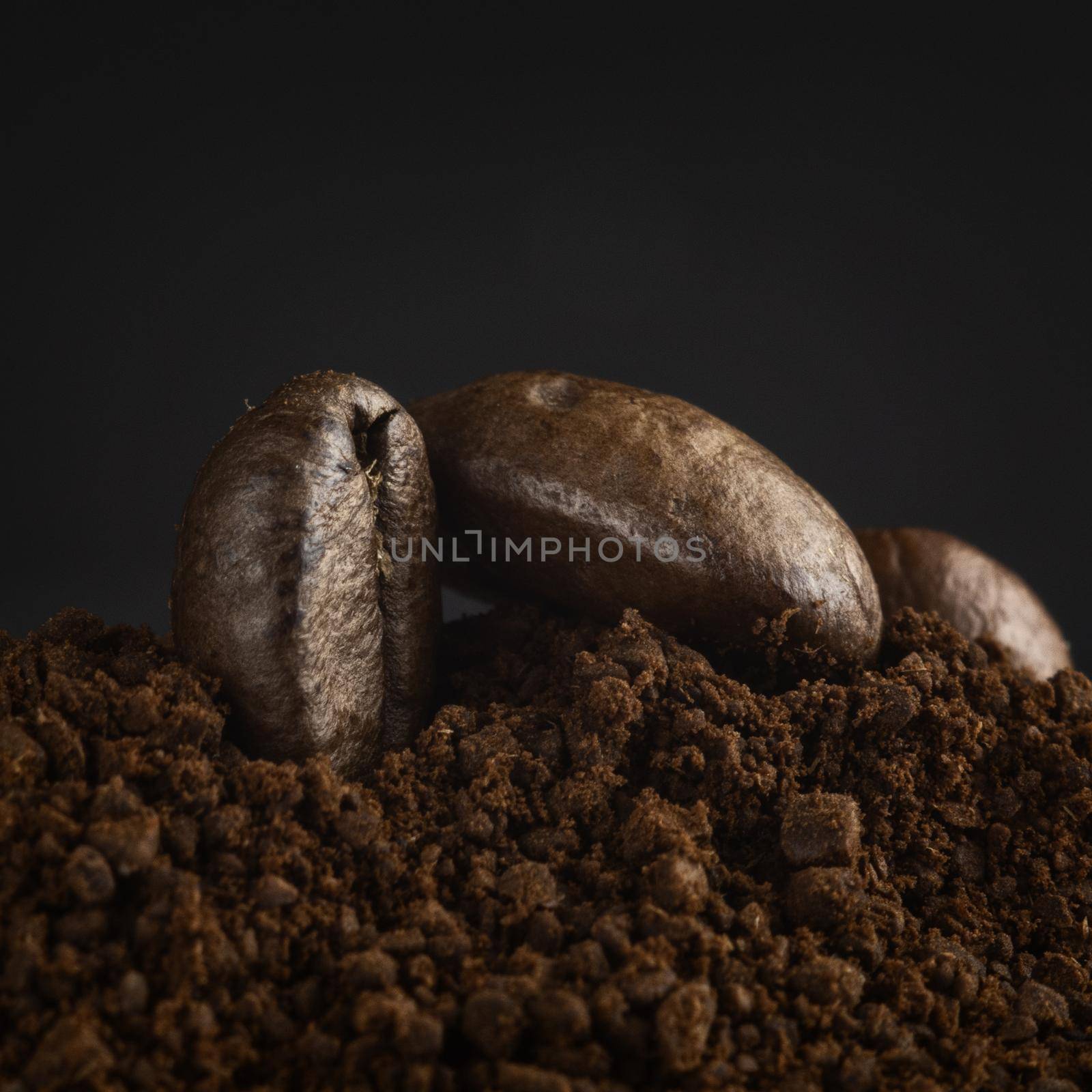 Brown roasted coffee beans, seed on dark background. Espresso dark, aroma, black caffeine drink. Closeup energy mocha, cappuccino ingredient.