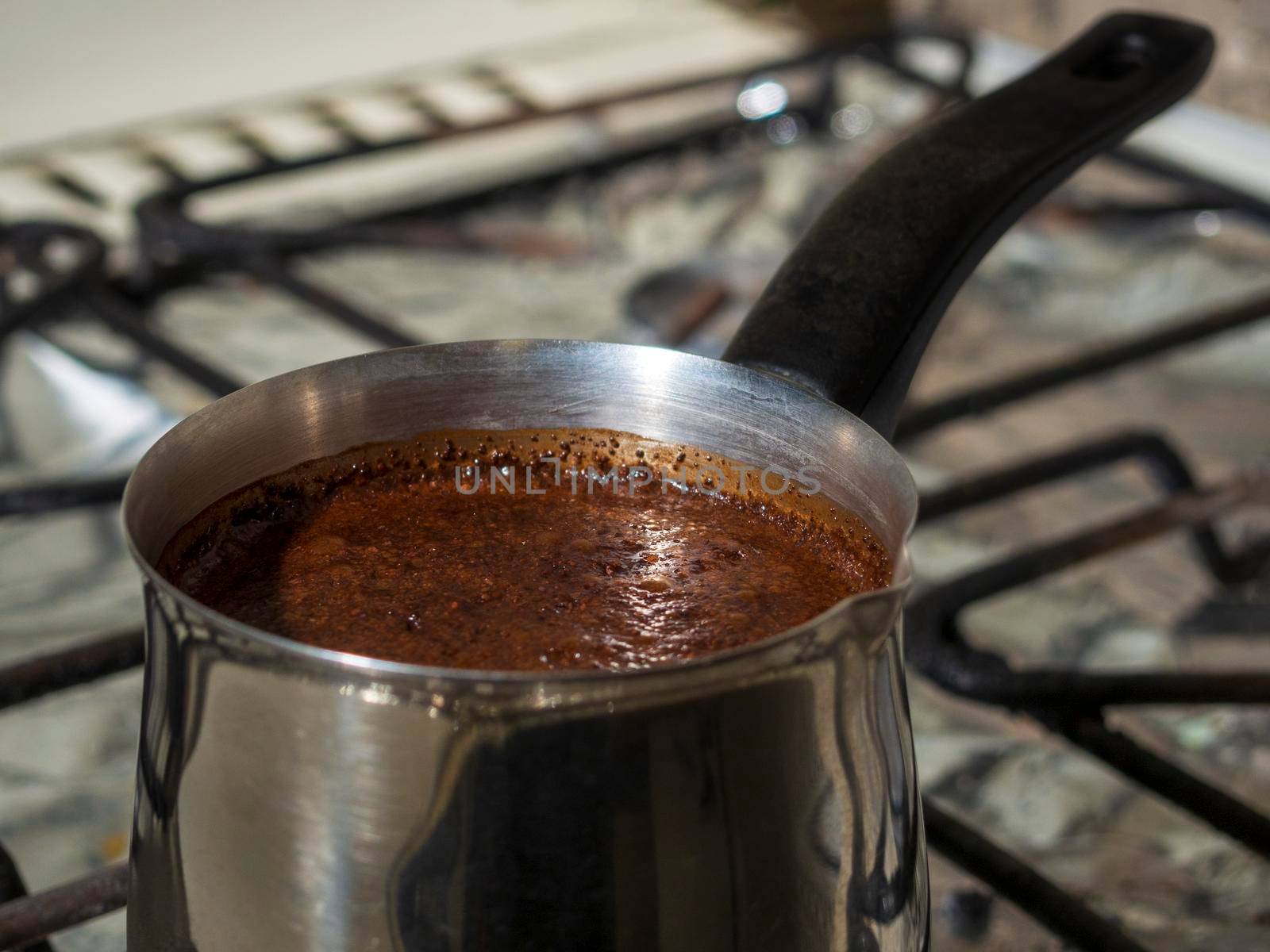 ground coffee is brewed in a steel Turk.