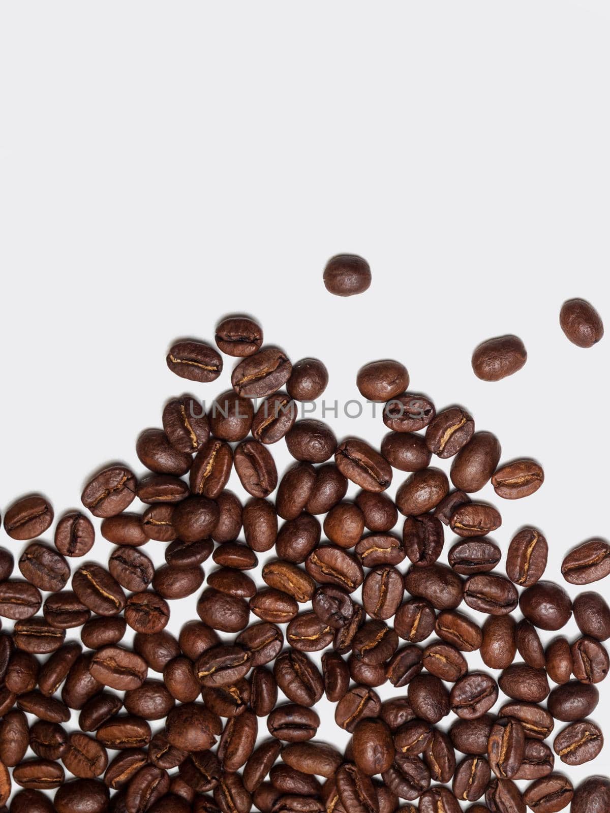 roasted coffee beans on white background.