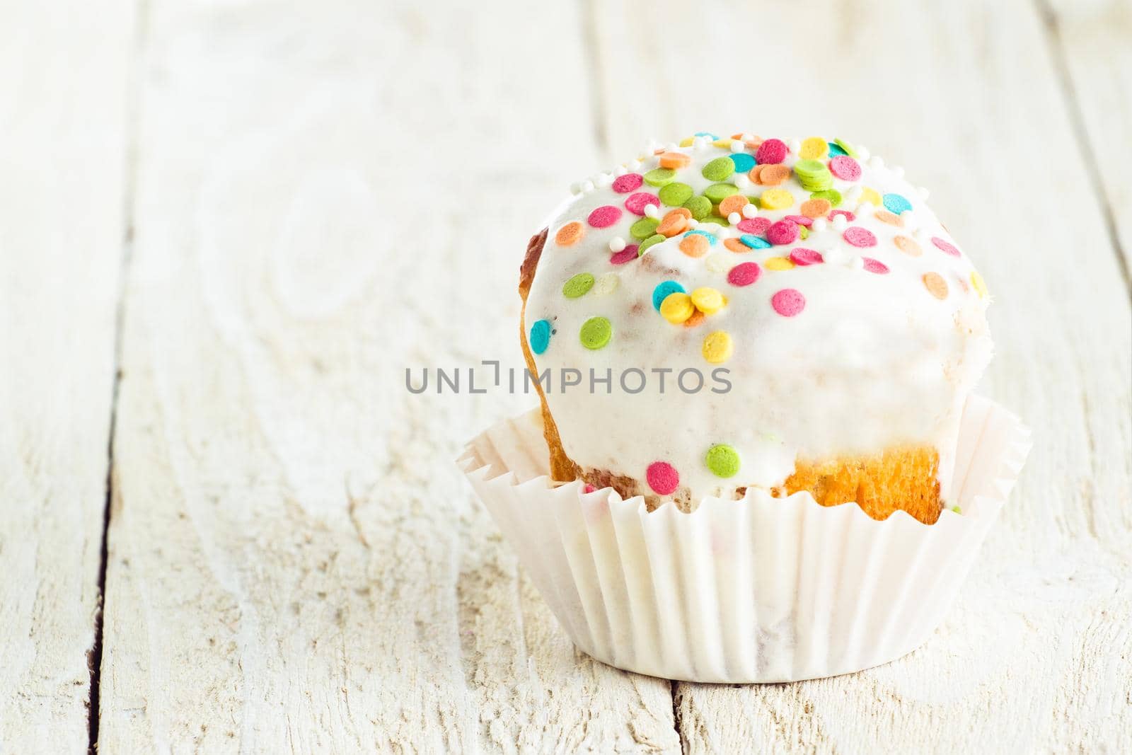 Tasty cake for holidays on a white wooden background