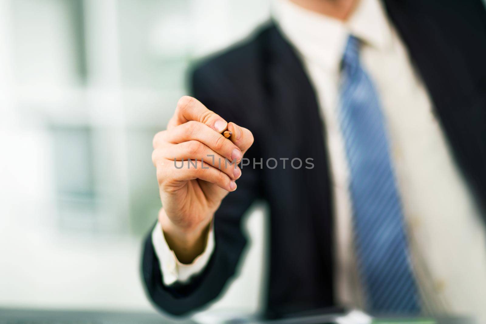 Businessman writing, drawing on the screen