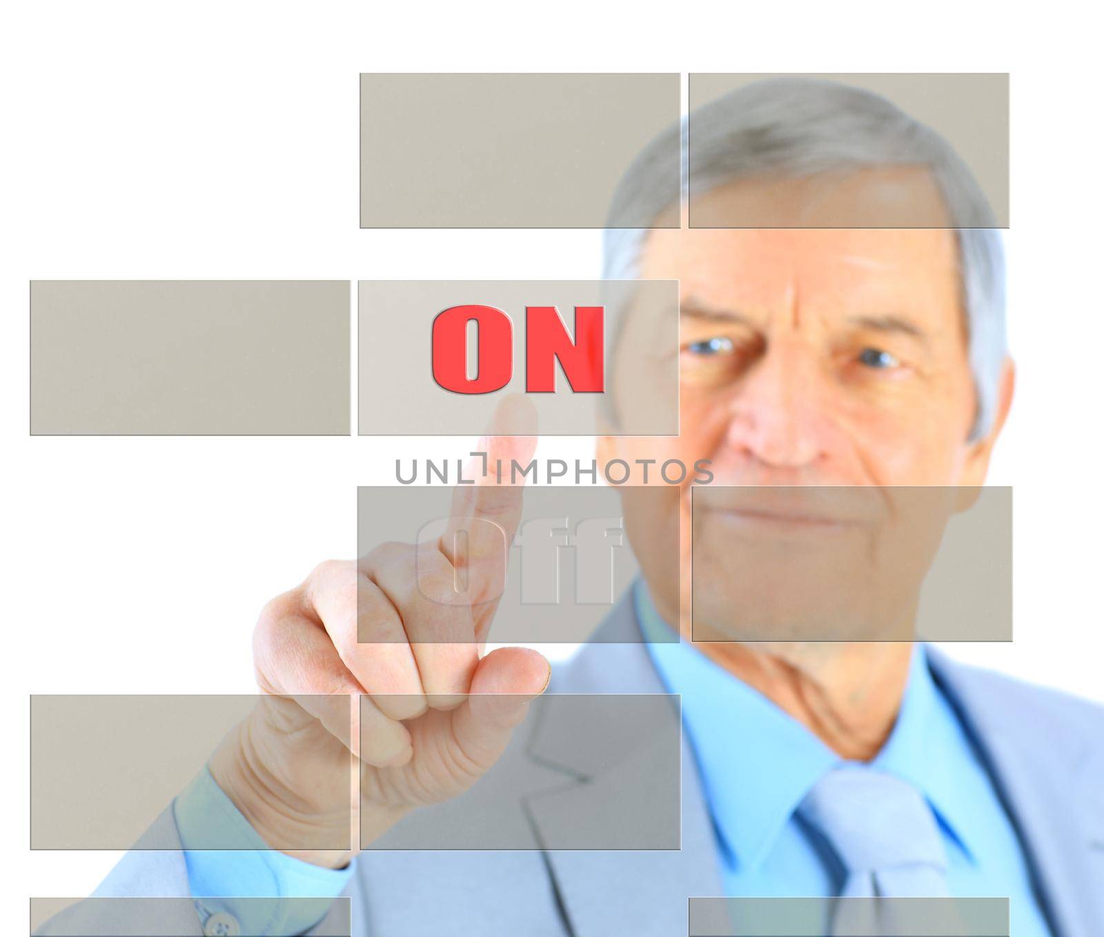 Businessman in age, click on the button. Isolated on a white background.