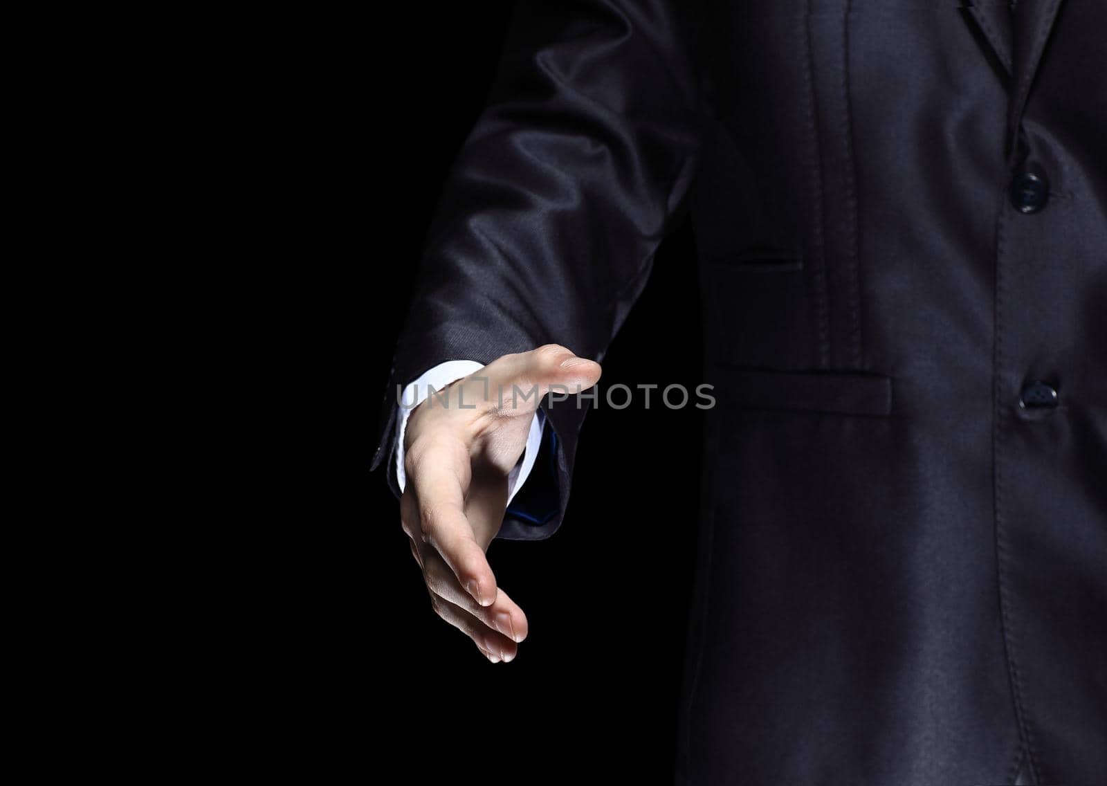 Businessman offering for handshake on office buildings background