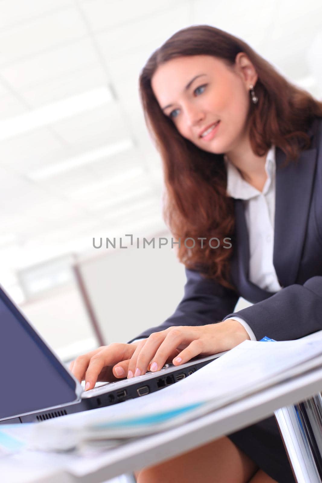 picture of happy woman with laptop computer by SmartPhotoLab