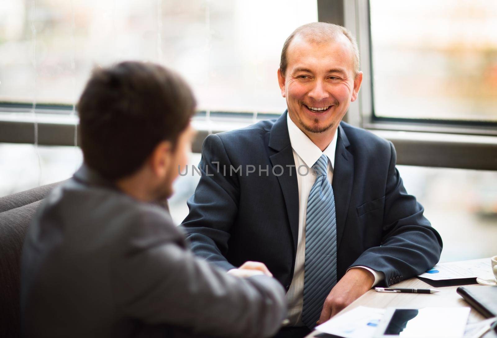 Business people shaking hands, finishing up a meeting