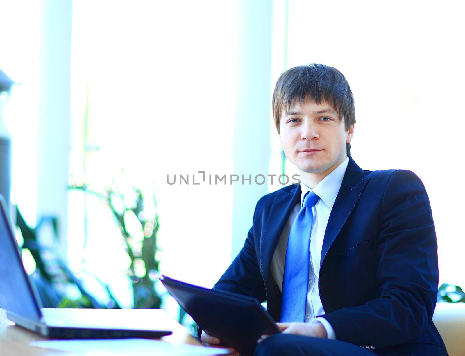 A young businessman in the office.