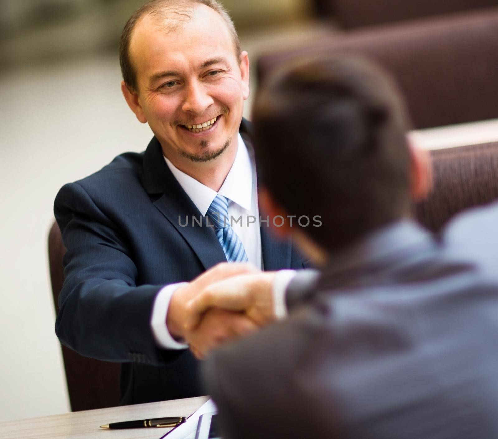 Business people shaking hands, finishing up a meeting