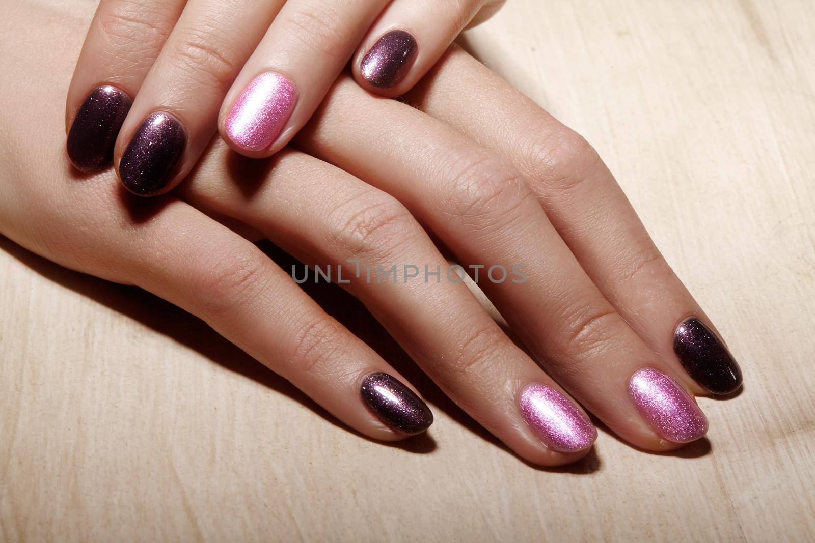 Manicured nails with shiny nail polish. Manicure with bright nailpolish. Fashion art manicure with shiny gel lacquer by MarinaFrost