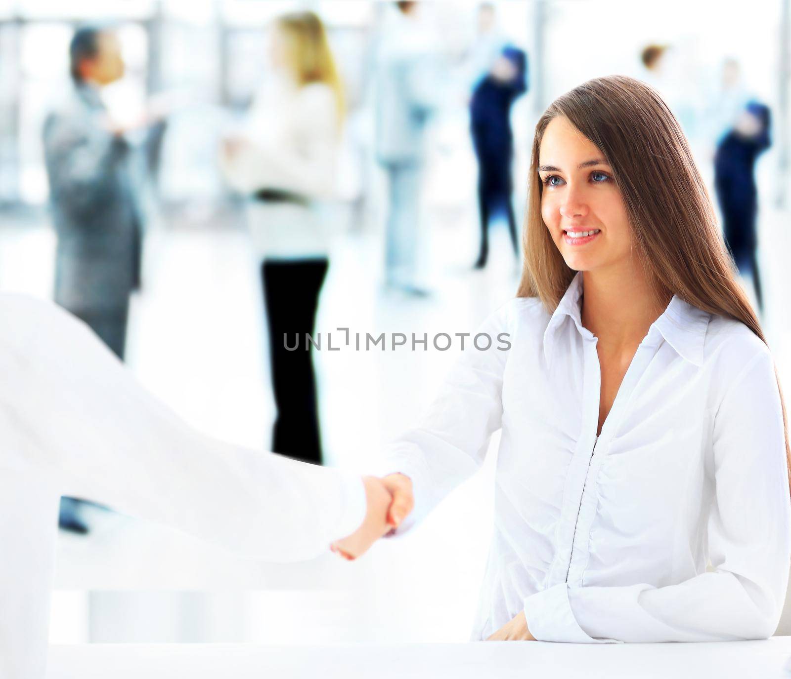 Cheerful businesspeople, or businesswoman and client handshaking