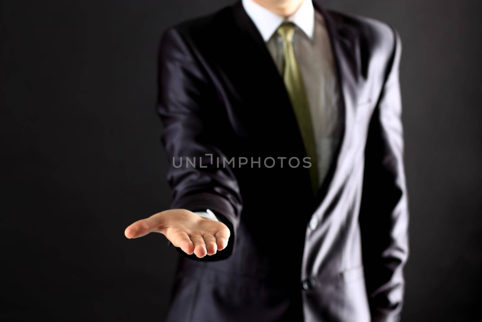 Businessman performing a hand gesture.