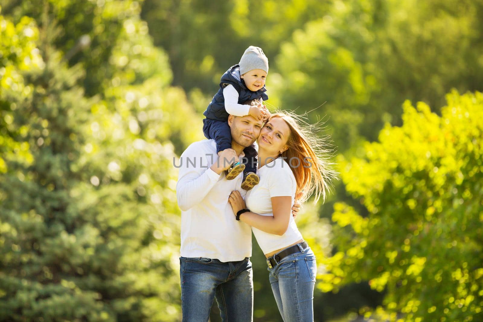 portrait of happy family walking in Park