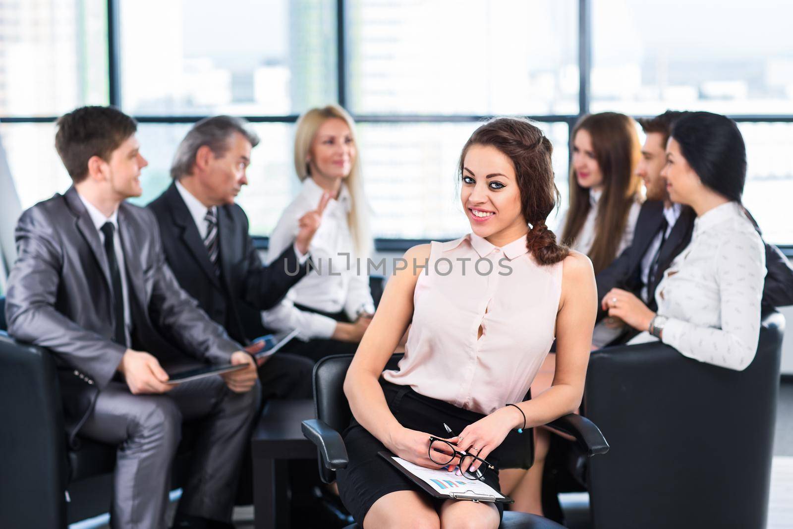 A group of businessmen discussing the policy of the company in the office.