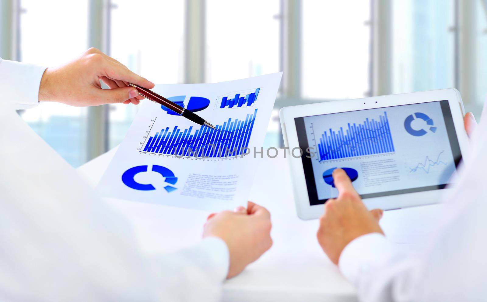 Close-up of Business people discussing a financial plan