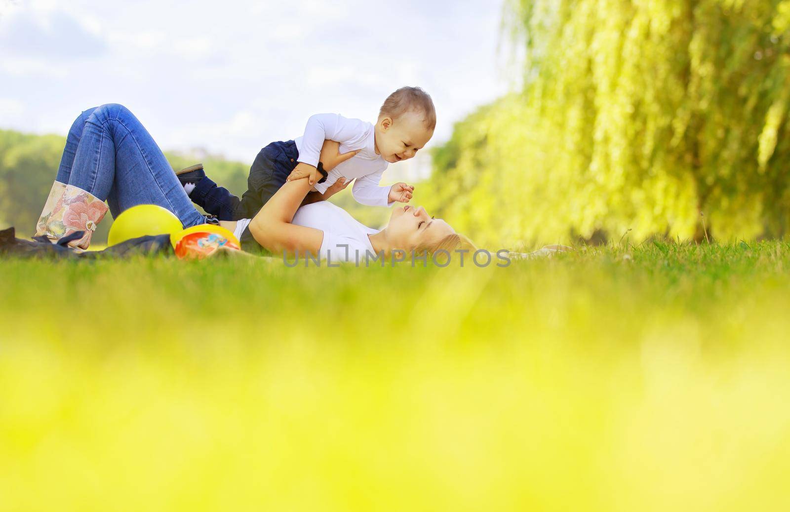 happy mother and son on a walk on a Sunny day by SmartPhotoLab