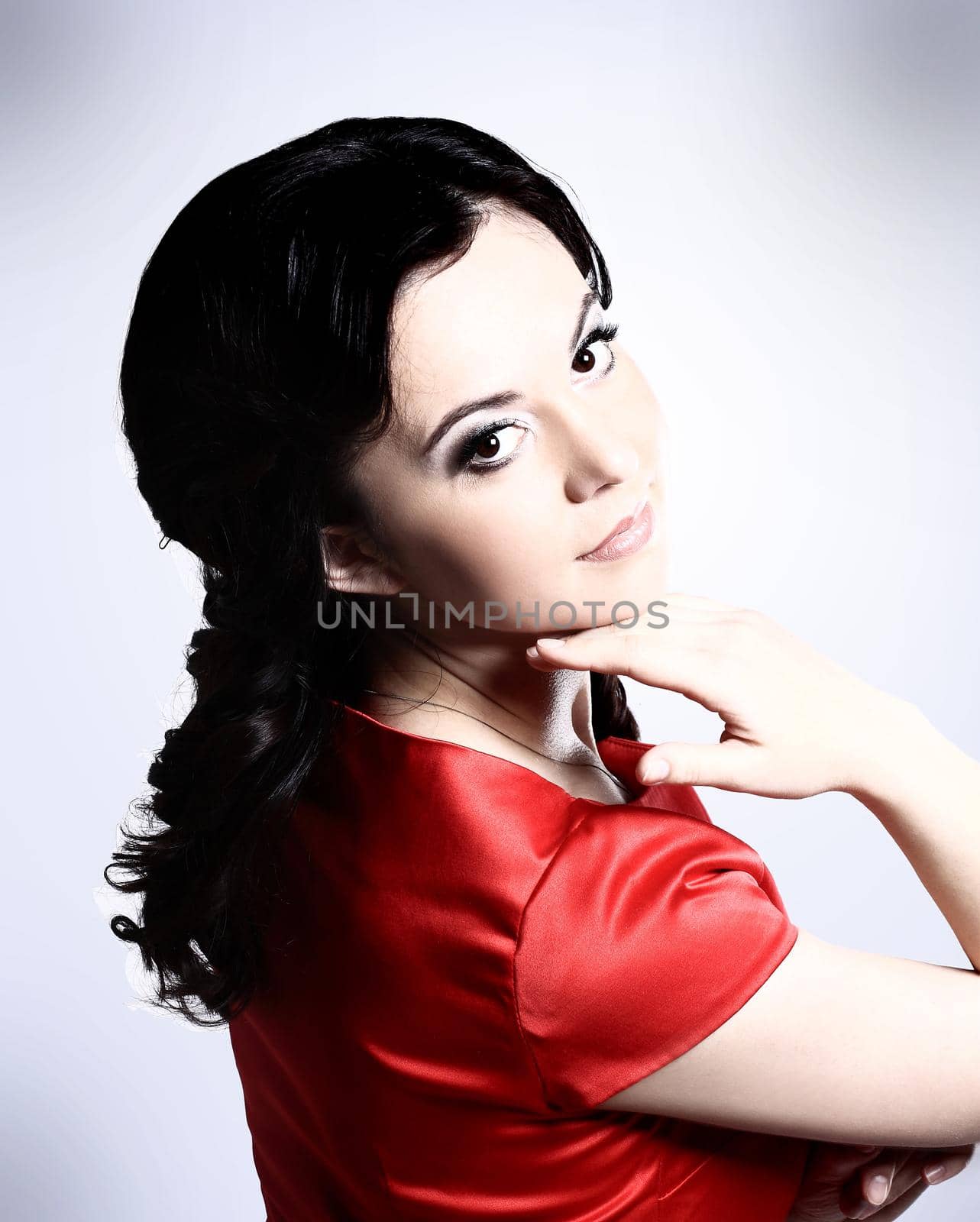 Happy young woman in red dress. Isolated over white background