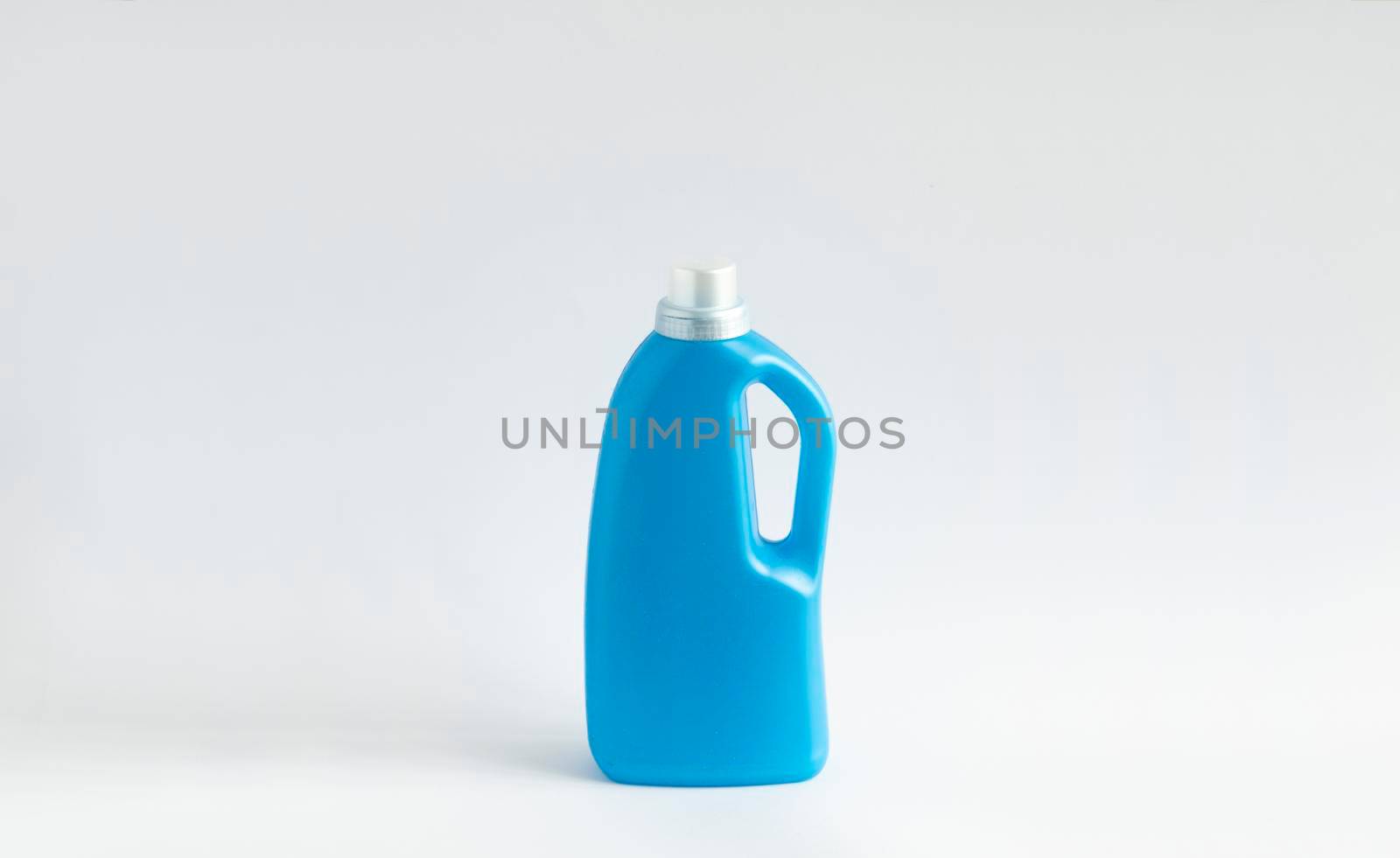 Big Blue plastic bottles of cleaning products isolated on white background. Mock up. Product design