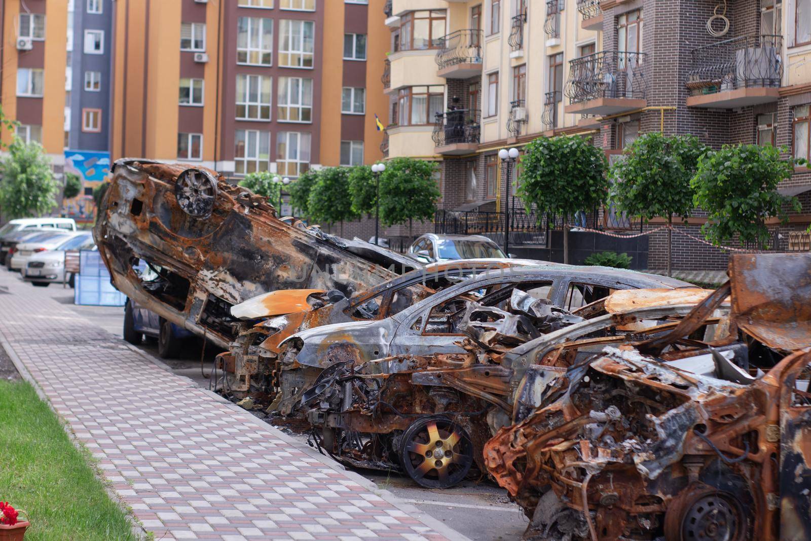 war in ukraine. Car graveyard. Shot cars of civilians. russia's war against Ukraine. Burnt and blown up car. Cars damaged after shelling. irpin bucha. war crimes.