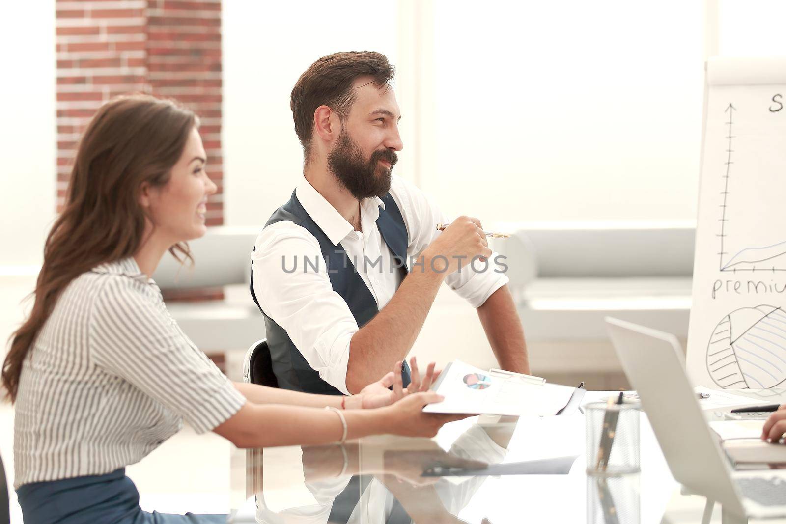businessman and business woman sitting at the Desk.photo with copy space.