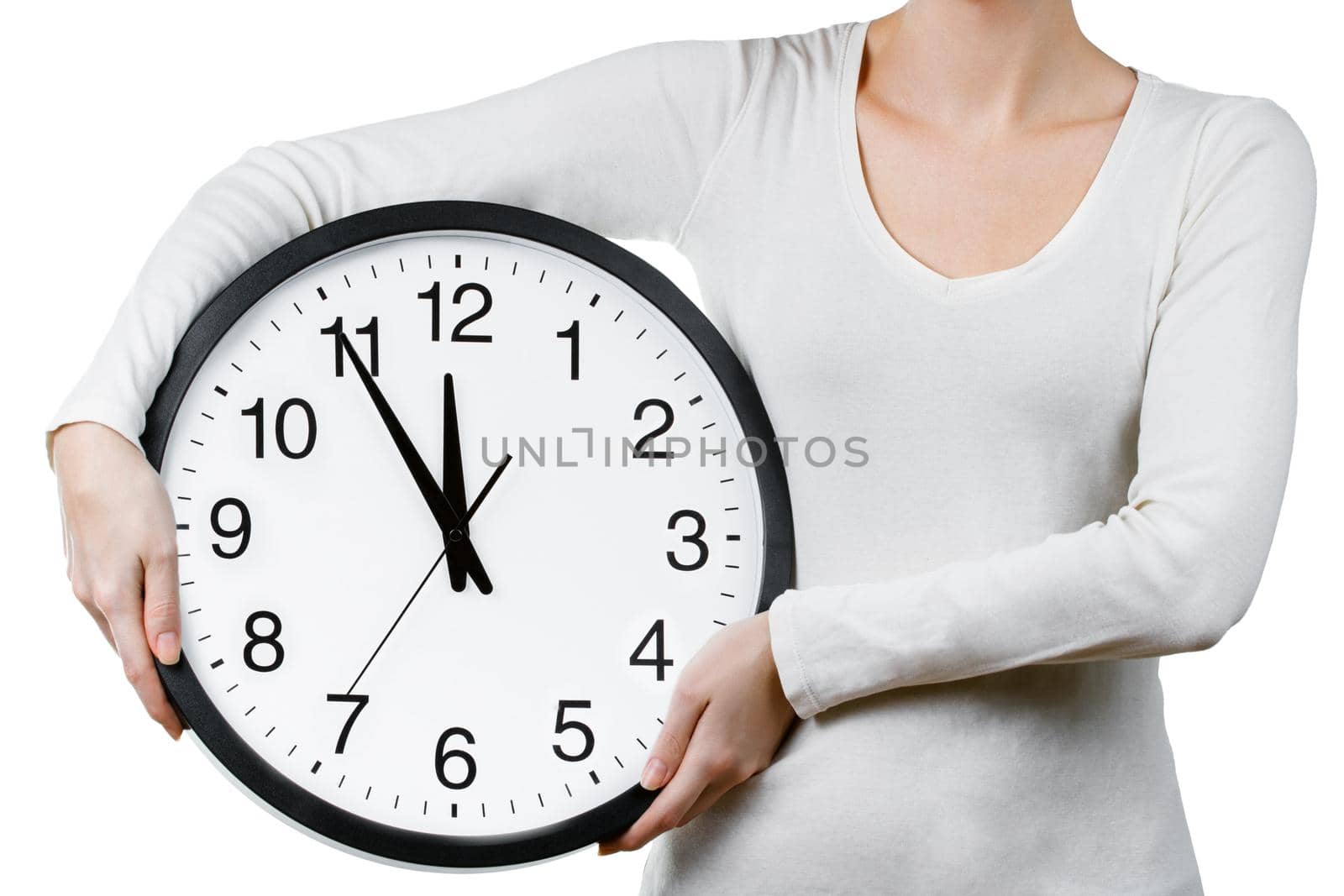Woman holding a clock isolated on a white background. Time management concept