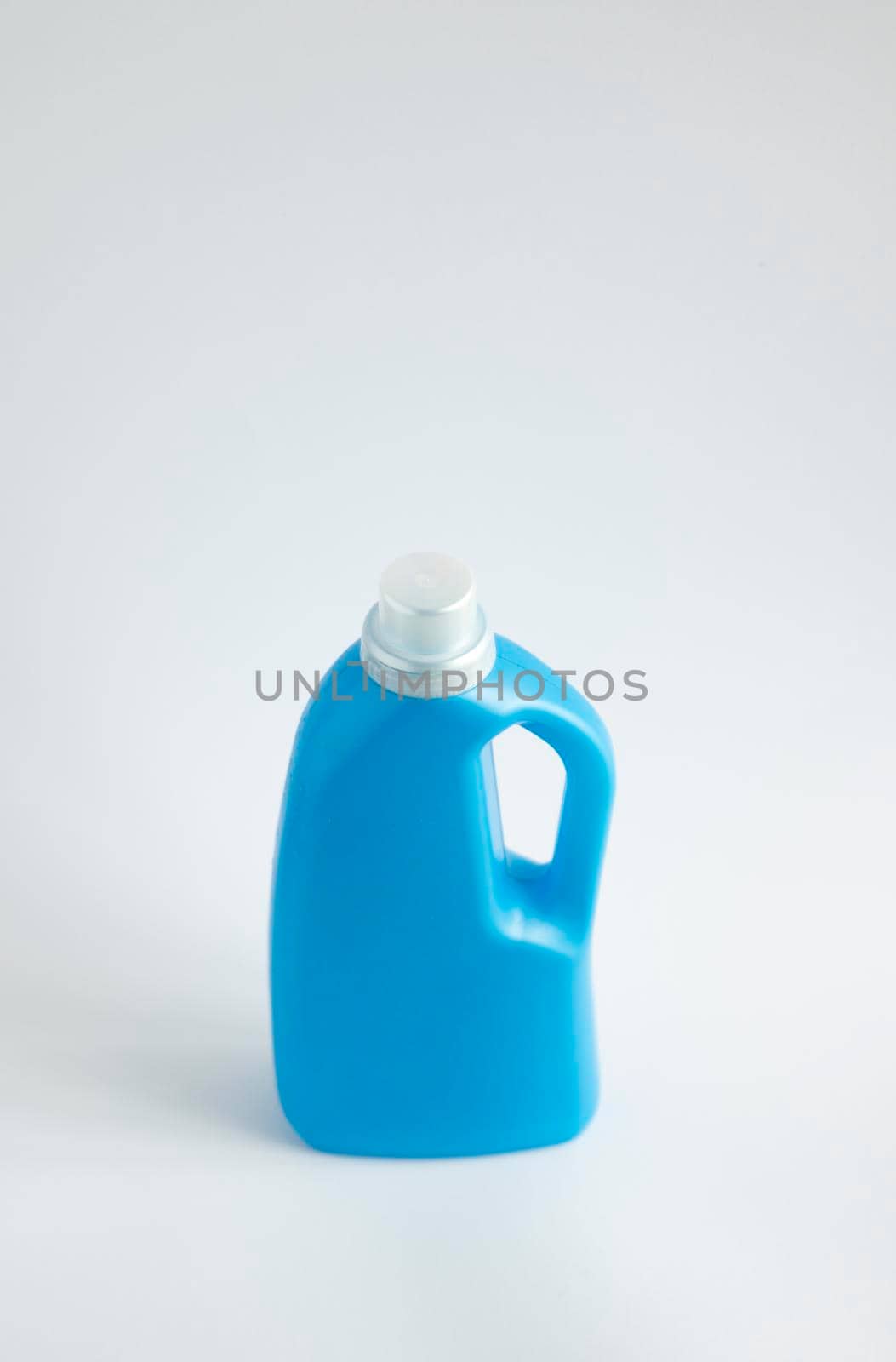 Blue plastic liquid detergent bottle isolated on white background. Laundry container, merchandise template. Product design. Mock up