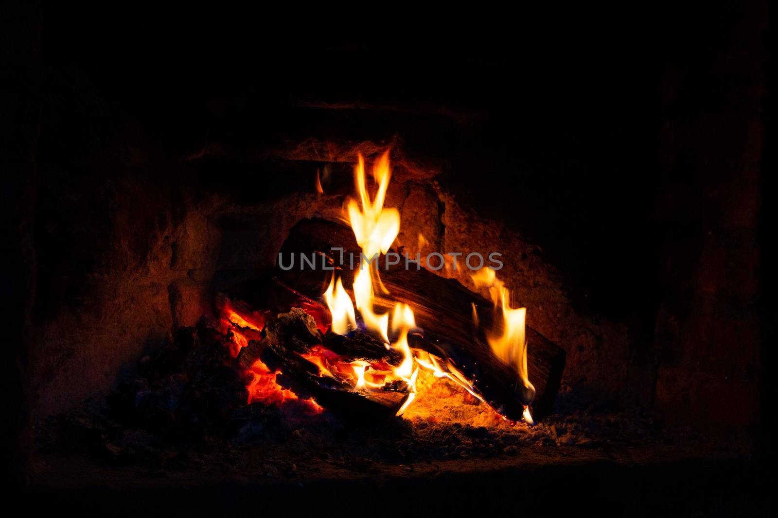 burning logs in the fireplace by GabrielaBertolini