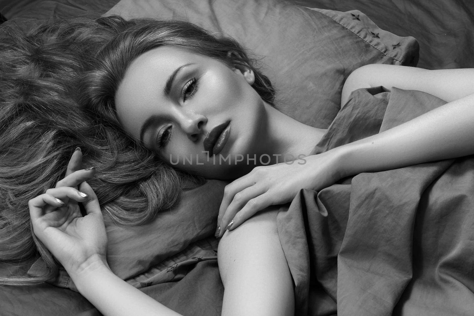 Beautiful Woman Sleeping while lying in Bed with Comfort. Sweet Dreams. Sexy Model Relaxing in Bedroom. Black and White by MarinaFrost
