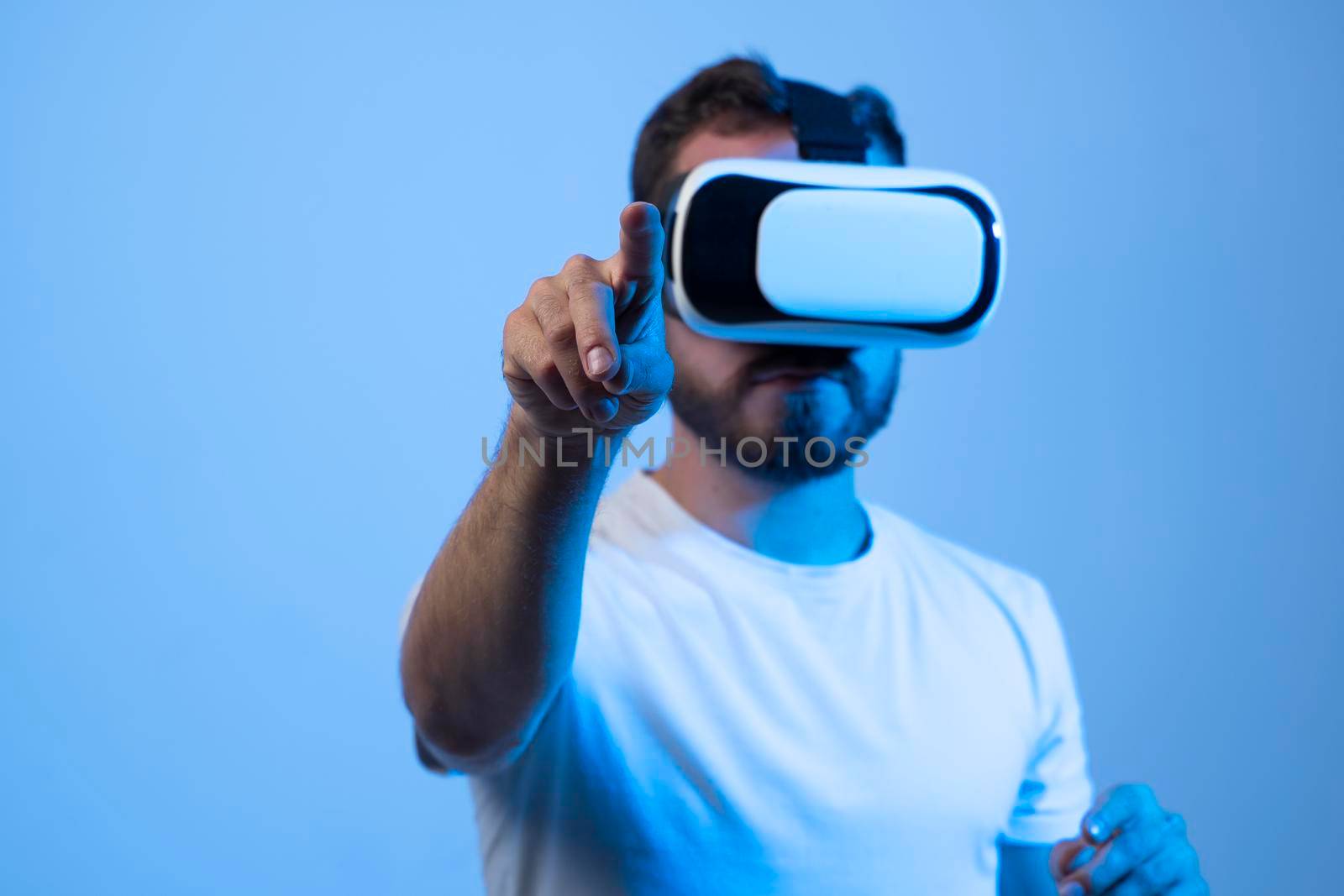 Young man developer working with a VR headset in a virtual world and create new products and applications