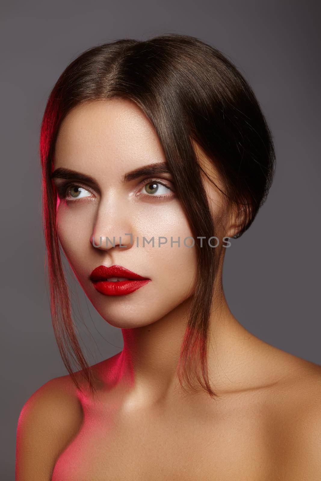 Beautiful model with fashion make-up. Close-up portrait sexy woman with glamour lip gloss makeup and bright eye shadows. by MarinaFrost