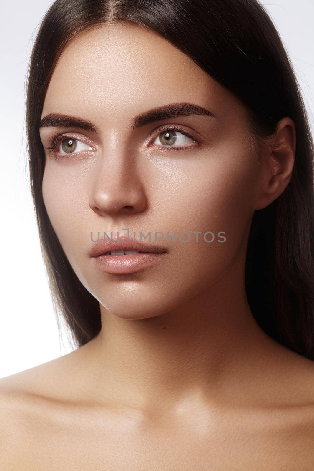 Beautiful face of young woman. Skincare, wellness, spa. Clean soft skin, healthy fresh look. Natural daily makeup by MarinaFrost