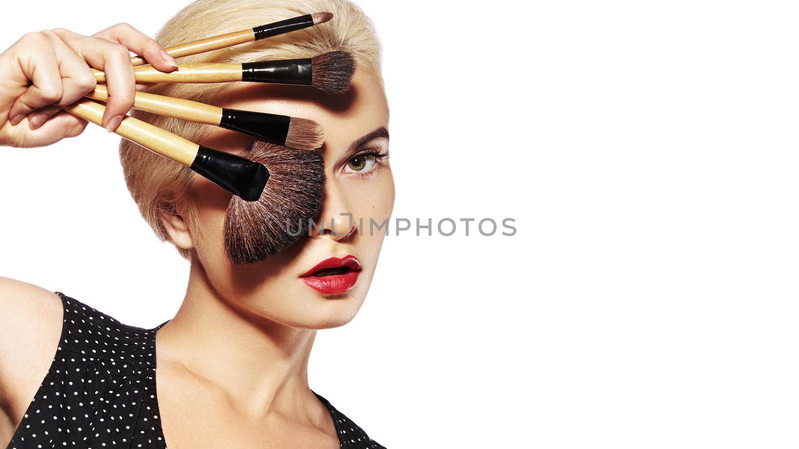 Girl with Makeup Beauty Accessories. Fashion Make-up for Sexy Woman. Make-up Artist Applying Visage on white background by MarinaFrost
