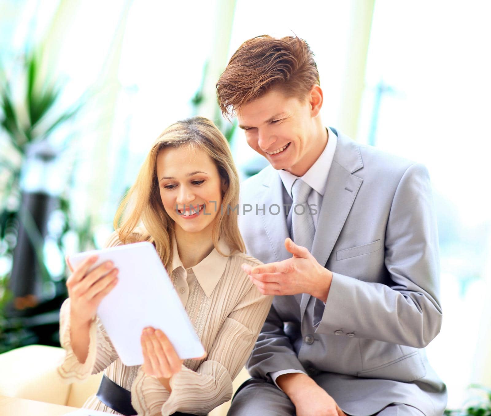 Business team interviewing young applicant in bright office by SmartPhotoLab