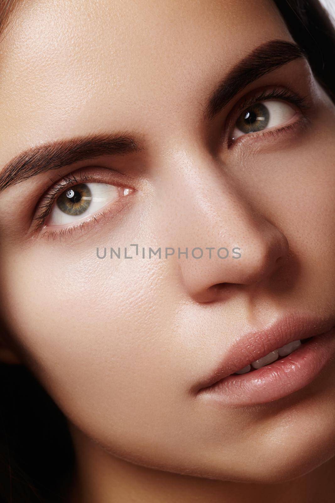 Beautiful face of young woman. Skincare, wellness, spa. Clean soft skin, healthy fresh look. Natural daily makeup by MarinaFrost