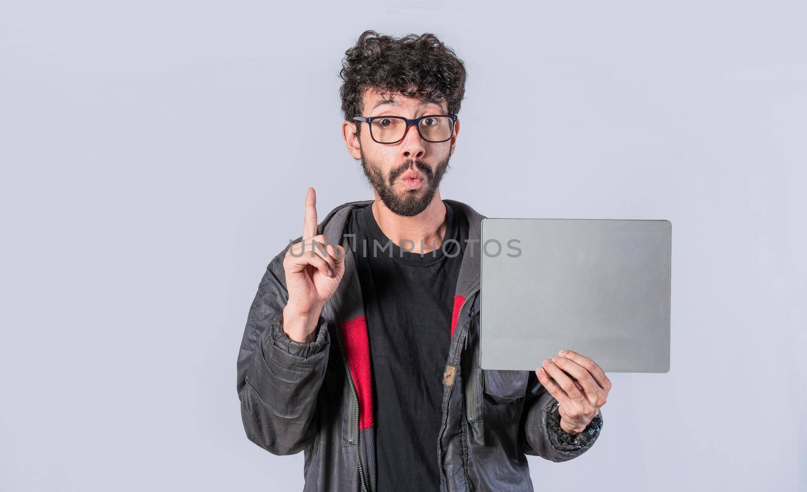 Young man holding poster, man showing blank signboard isolated, guy showing poster with blank space