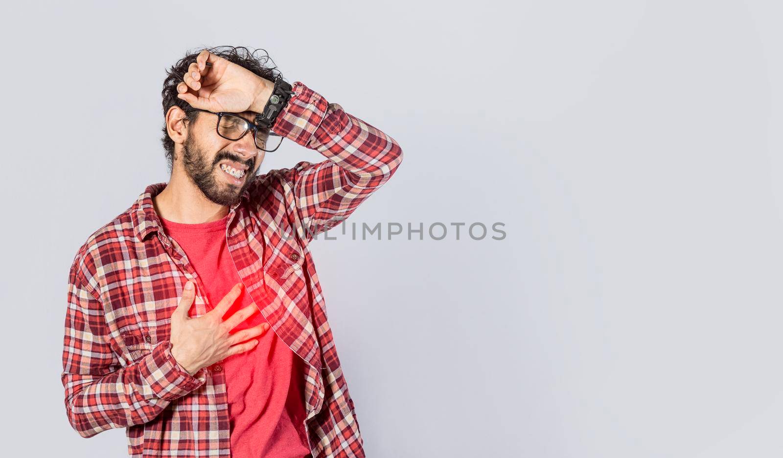 Man with heart pain on isolated background, man with chest pain, on isolated background, tachycardia