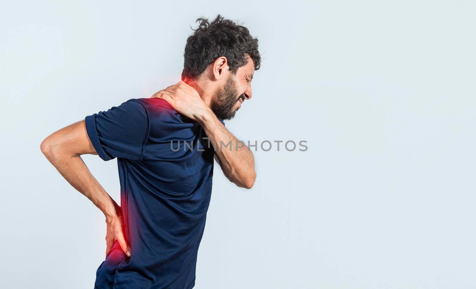 Man with spine and shoulder problems, person with back and shoulder problems on isolated background, lumbar and muscular problems concept