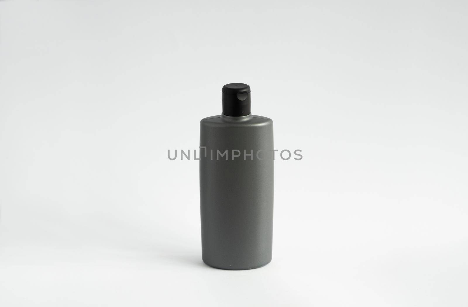 Gray bottle of shampoo, conditioner, hair rinse, mouthwash, on a white background. by vovsht