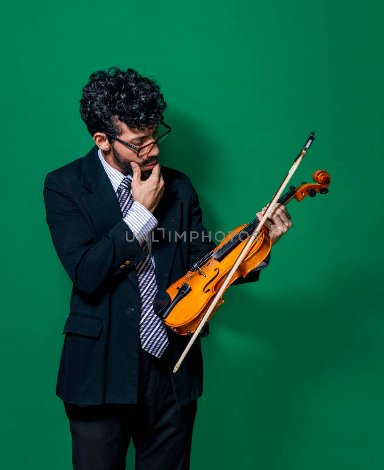 Happy violinist with her violin, violinist showing her violin on isolated background