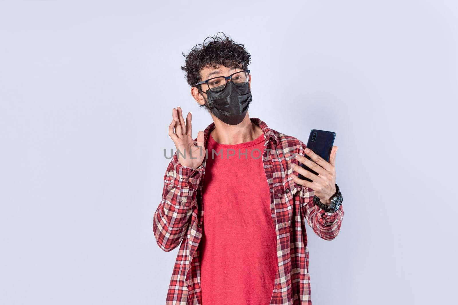 Man making video call isolated, guy making video call with face mask, face mask video call concept