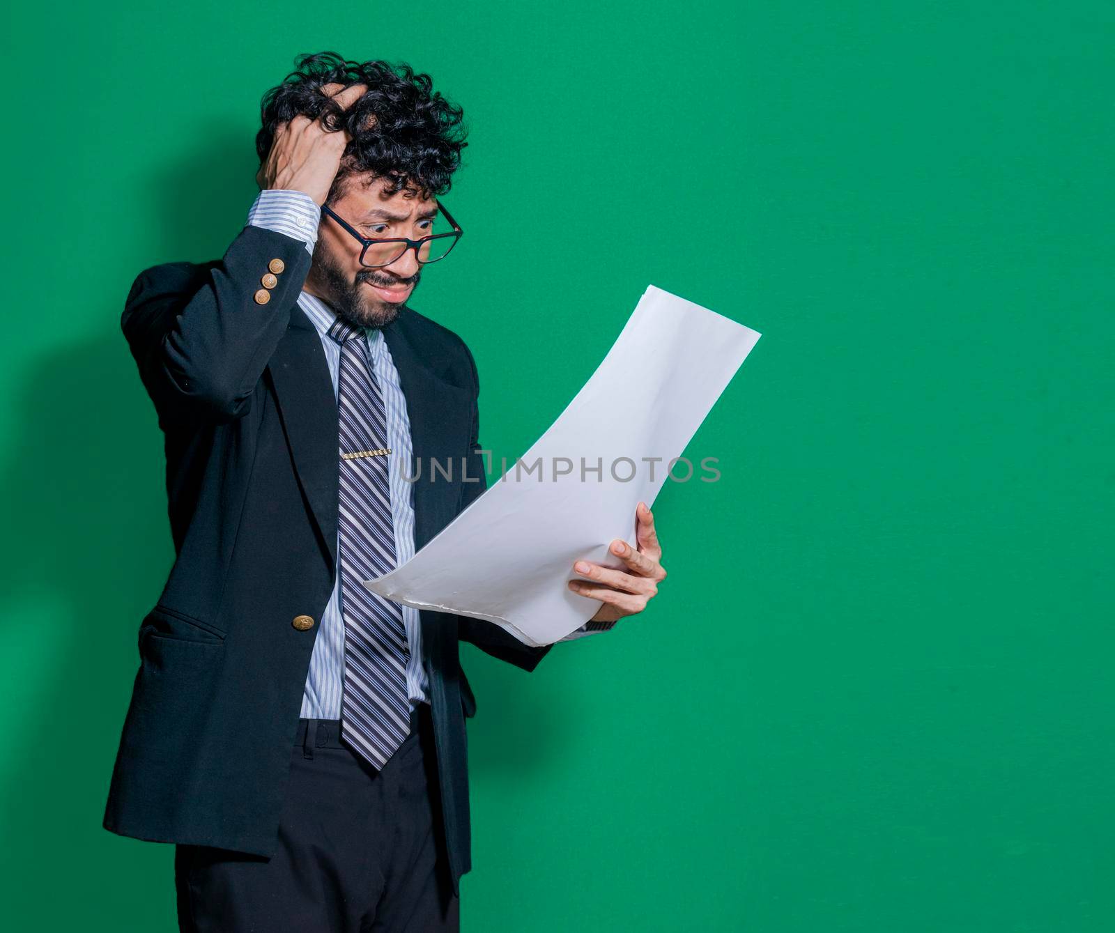Confused businessman with documents in hand, puzzled businessman with documents in hand