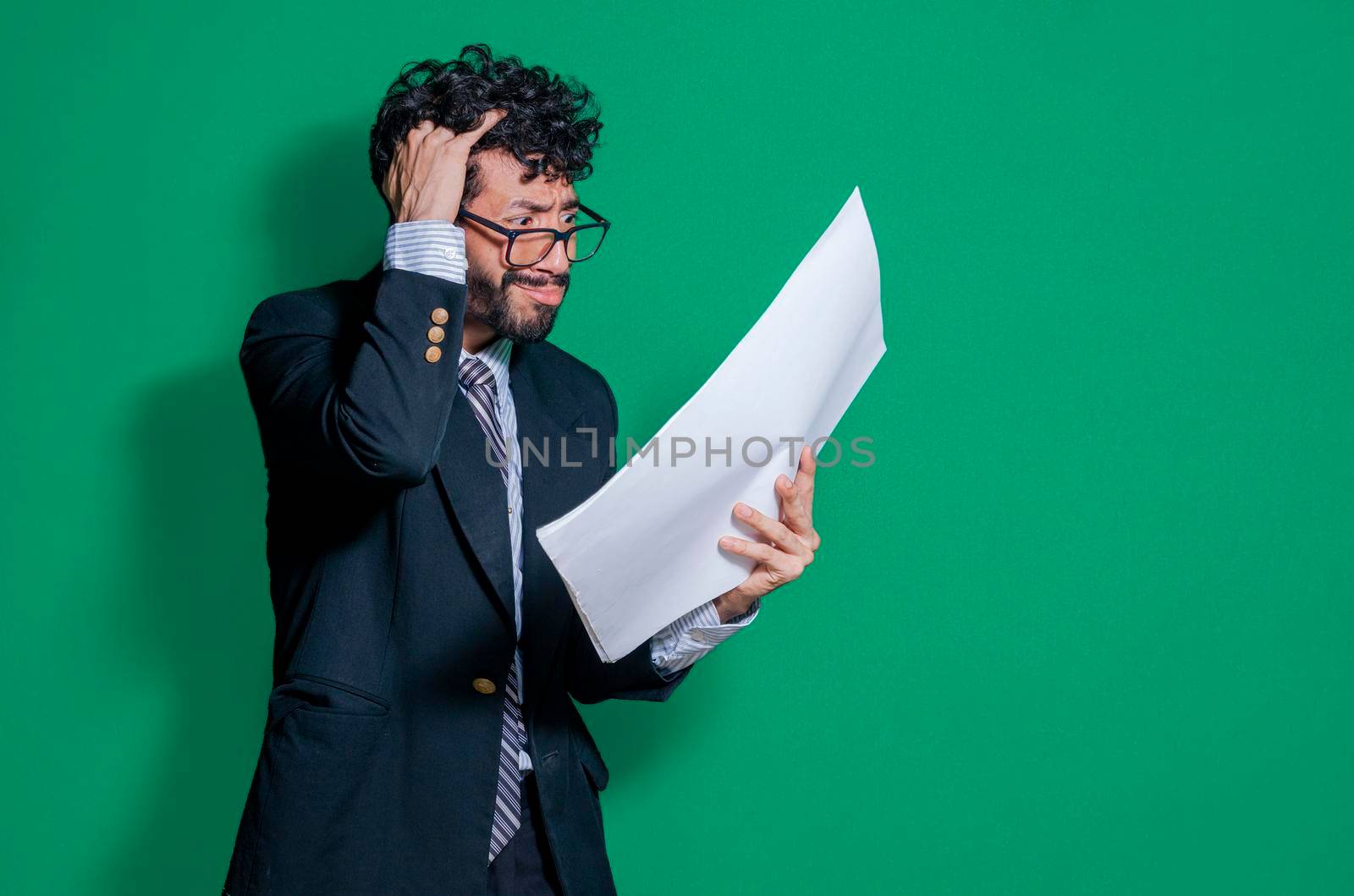 Confused businessman with documents in hand, puzzled businessman with documents in hand