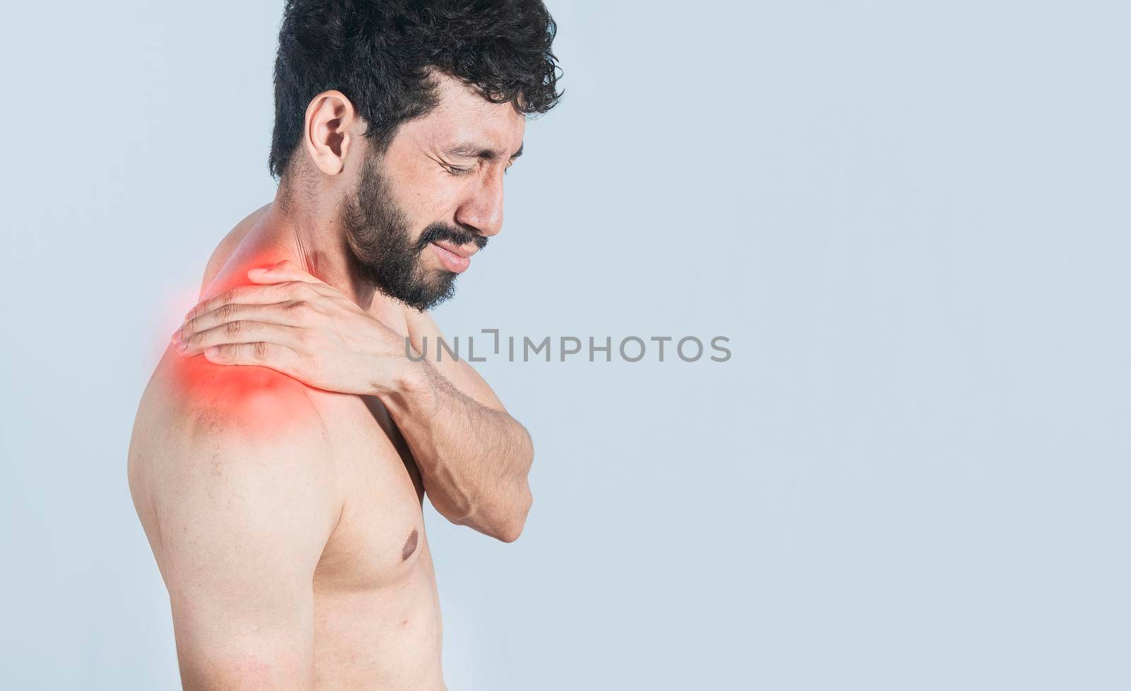 Neck pain and stress concept, shirtless man with neck muscle pain, Close-up of a man with neck pain, a man with neck pain on an isolated background.