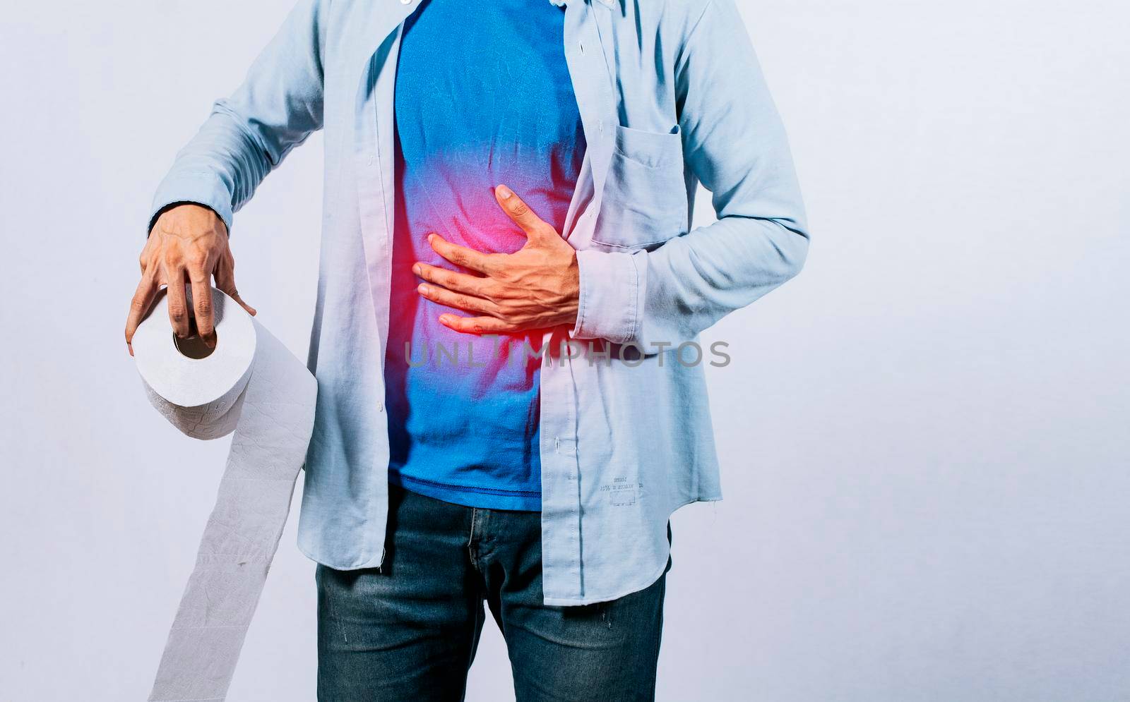 Man with stomach problems holding toilet paper, Person with toilet paper with stomach problems on isolated background, Concept of a person with digestive problems
