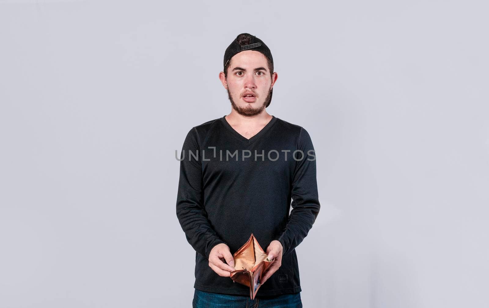unhappy and surprised man looking in an empty wallet, man seeing his empty wallet, young man with wallet without money