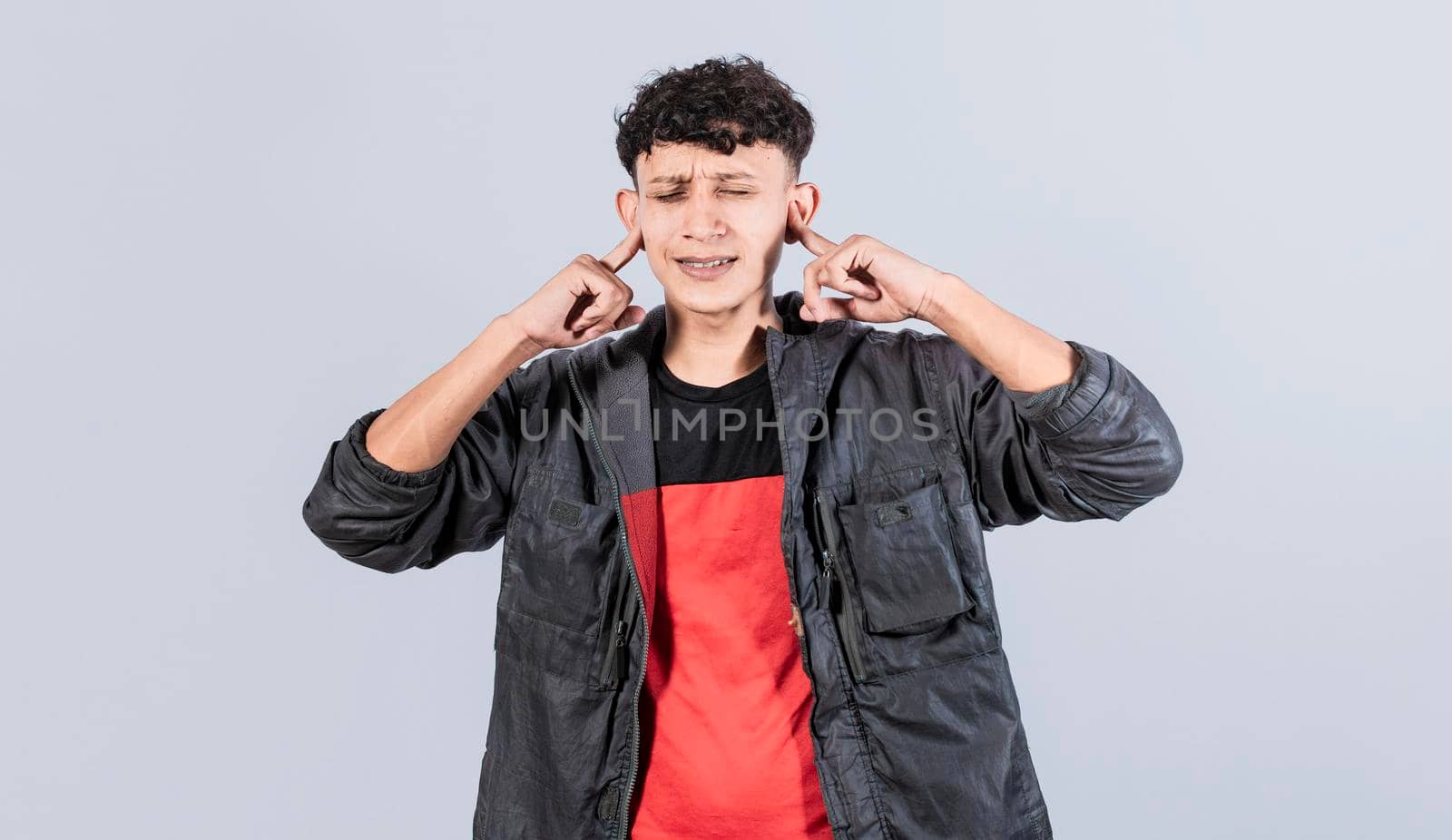 Man covering his ears isolated, guy covering his ears on isolated background, people with hands on his ears isolated, man ignoring problems covering his ears
