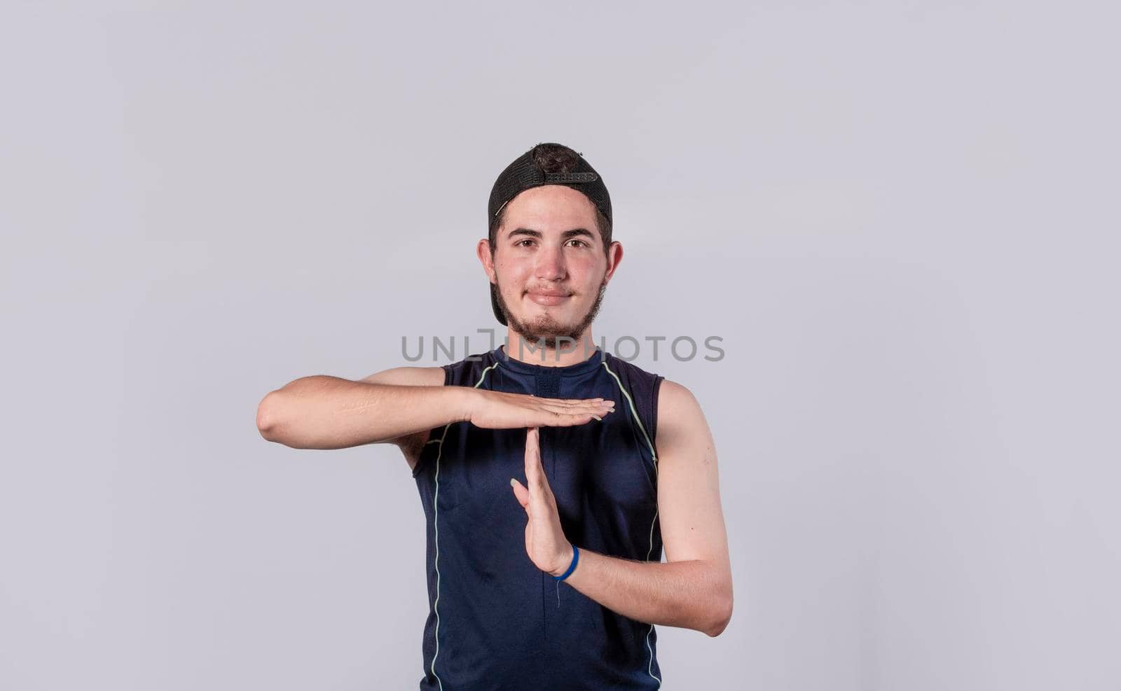Man making time out gesture, latin guy making time out gesture