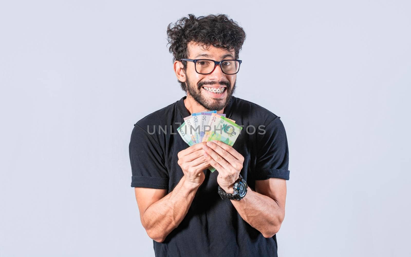Happy man with money in hand, joyful man with bills in hand, concept of man with money isolated